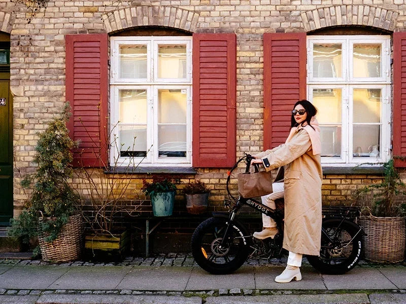 Hygge folding electric bike with rider on a city street