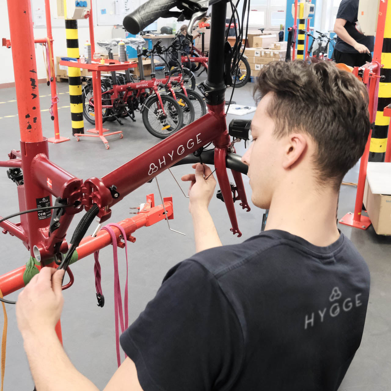 A technician repairing a Hygge e-bike, highlighting the brand’s nationwide repair and support service across the UK and EU